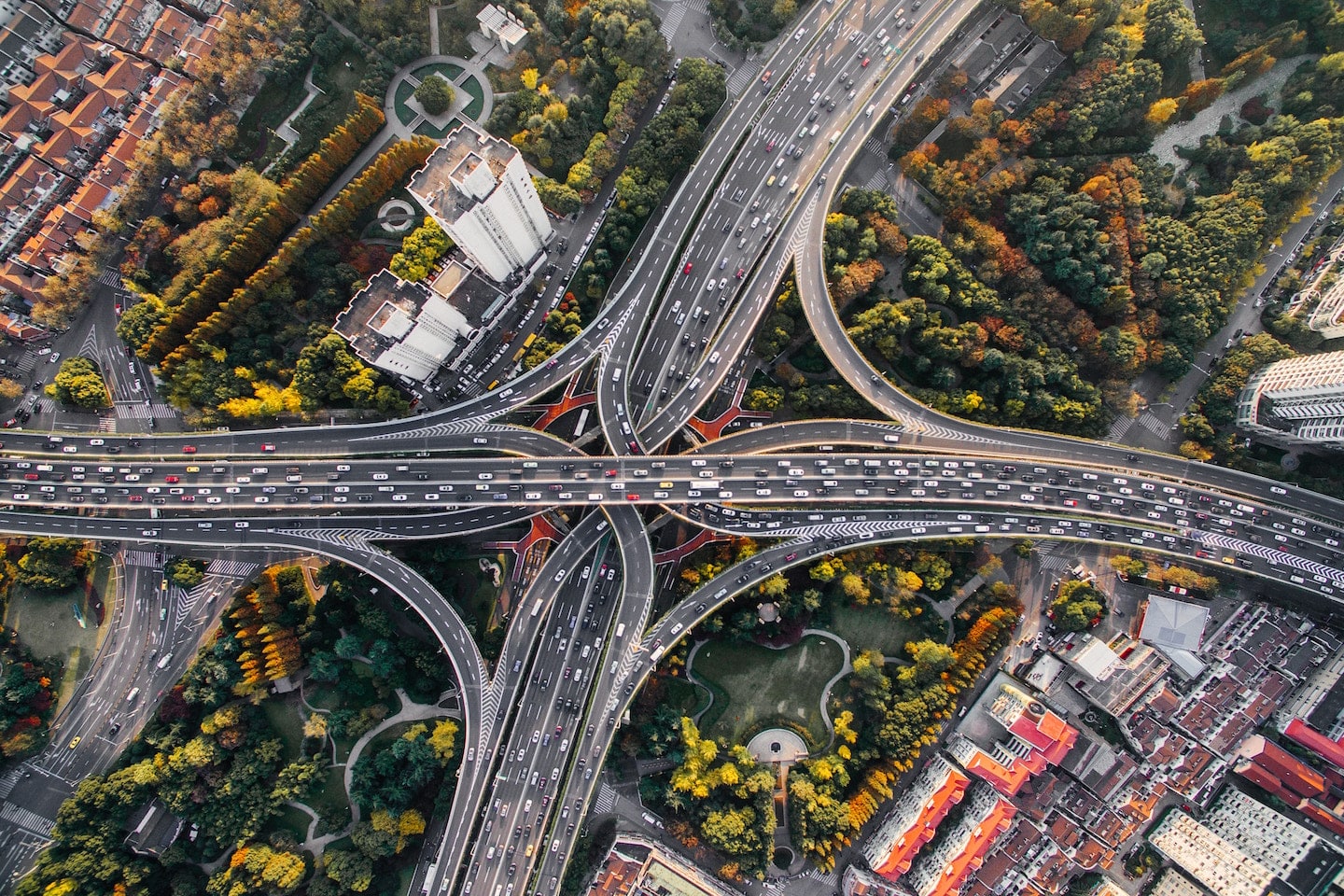 aerial view of city highways and moving traffic from drones