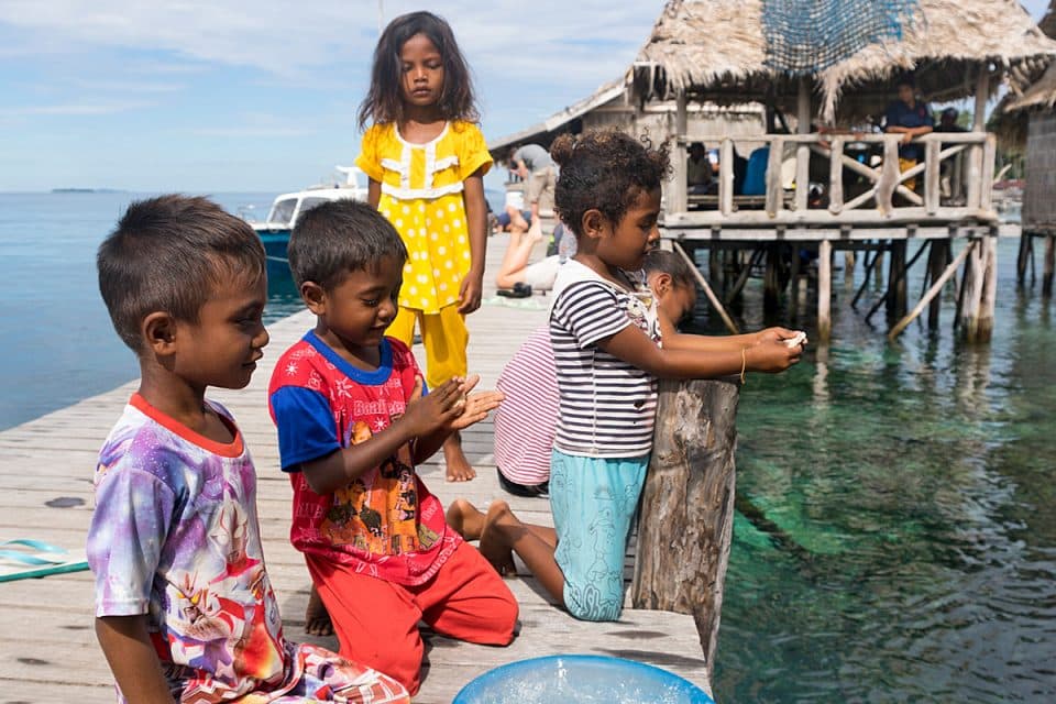 Children on Sawinggrai island, Raja Ampat, Indonesia