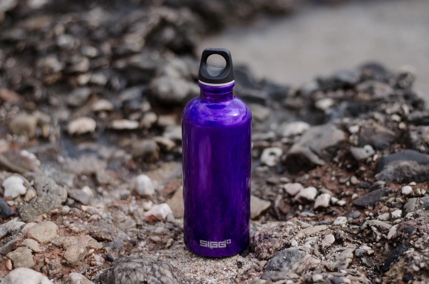travel water bottle on rock